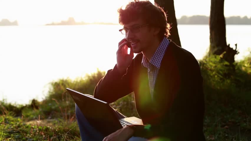 Male Uses Laptop Outdoors | Shutterstock HD Video #13217048