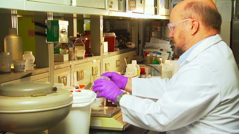 CIRCA 2010s - Researchers conduct experiments at the Pacific Northwest National Laboratory in a generic lab environment.