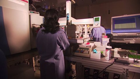 CIRCA 2010s - Researchers conduct experiments at the Pacific Northwest National Laboratory in a generic lab environment.