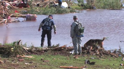 CIRCA 2010s - U.S. army personnel help cleanup after a devastating tornado in Piedmont, Oklahoma in 2011.