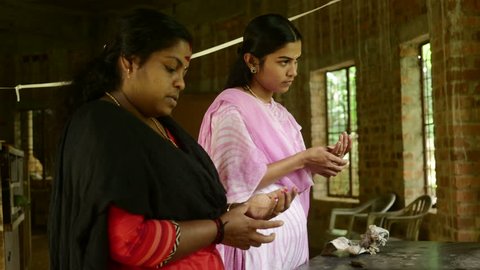 Indian Family Making Handmade Clay Jewellery 