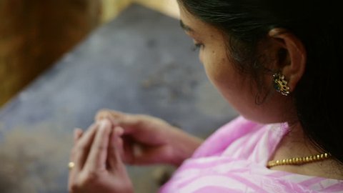 Indian Girl making Handmade Clay Jewellery 