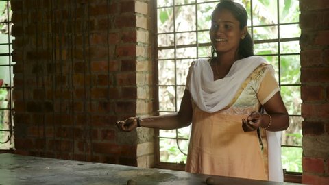 Happy Indian Woman Making Handmade Clay Jewellery 