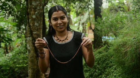 Indian Girl Presenting Handmade Clay Jewellery 