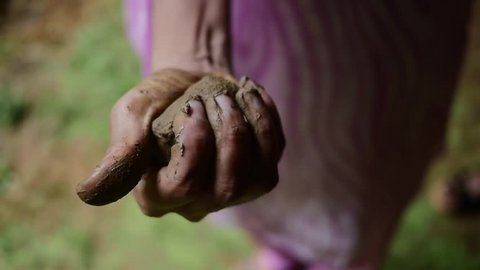Indian Hand Holding Wet Clay for Handmade jewelry