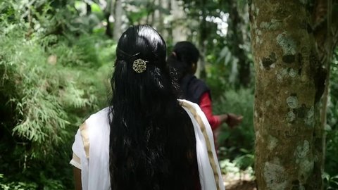 Beautiful Young Indian Girl Walking Through Jungle in Nice Dress