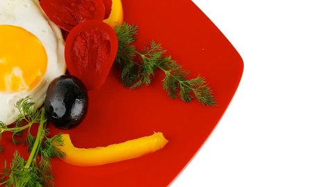 fried scrambled eggs eye with white goat feta cheese on red plate with black olives and vegetables 1920x1080 intro motion slow hidef hd