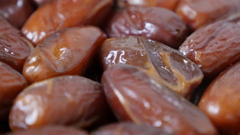 Dried exotic dates palm fruit packed n the original package 4K 2160p 30fps UltraHD  tilting footage - Phoenix dactylifera tasty Arabic fruit in row close-up 4K 3840X2160 UHD video