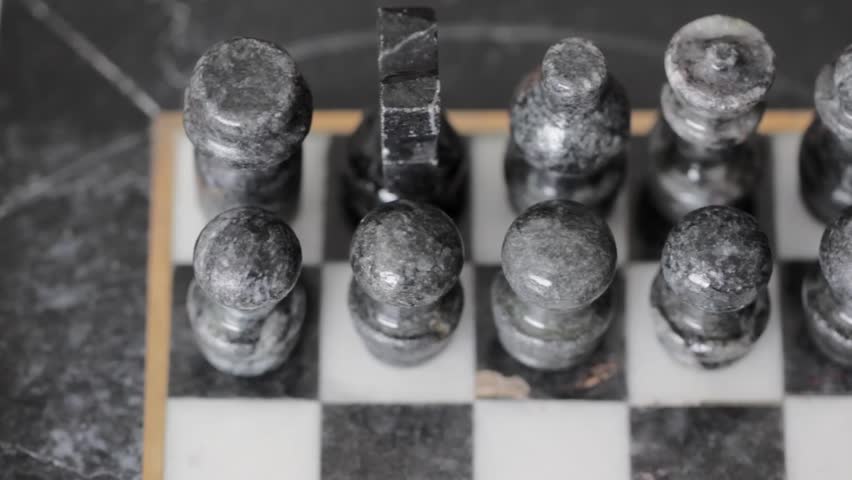 Playing chess with an old marble chess set