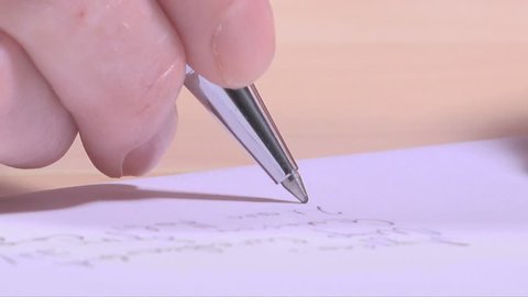 Woman writing address on envelope, extreme close up macro footage
