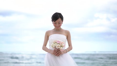 Beautiful asian woman dressed as a bride Stock Video