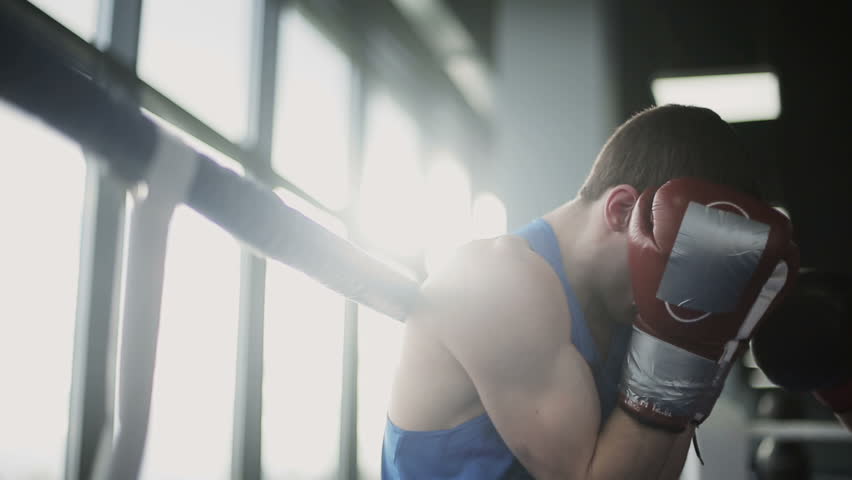 Two young professional boxers are fighting on the boxing ring | Shutterstock HD Video #13258535