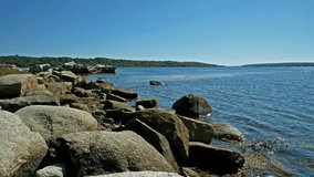Video of the rocky coastline at Stockton Springs, Maine with the harbor in the distance during the summer.