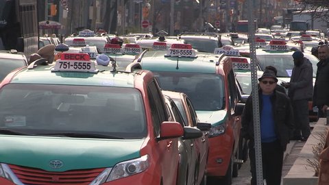 Toronto, Ontario, Canada December 2015 Toronto taxi and cab drivers protest against UBER by blocking traffic
