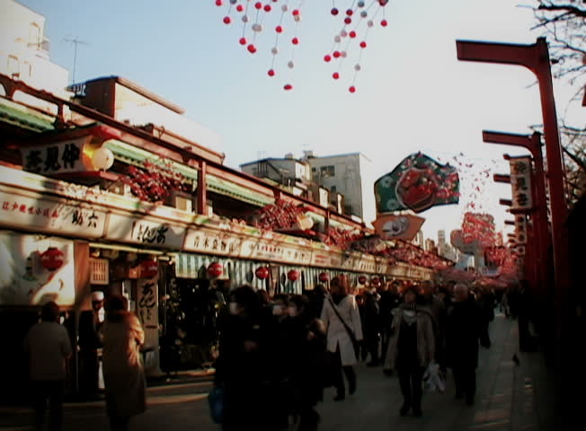 YOKOHAMA, JAPAN - CIRCA DECEMBER 2007 - Crowded Japanese market street, circa
