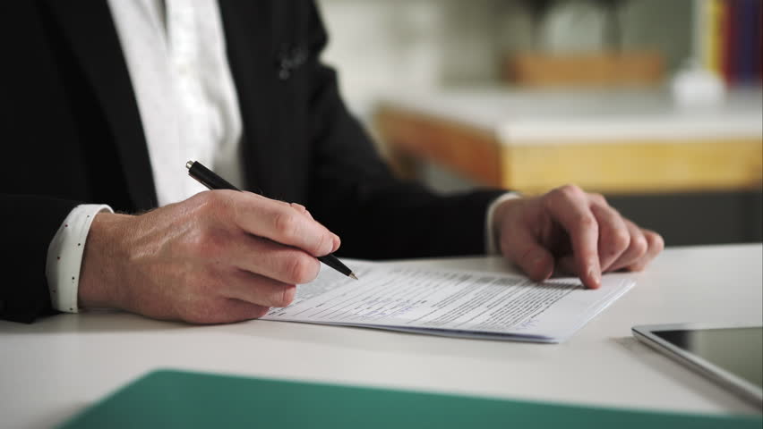 Man sign documents turning over the sheets. UHD Royalty-Free Stock Footage #13281782
