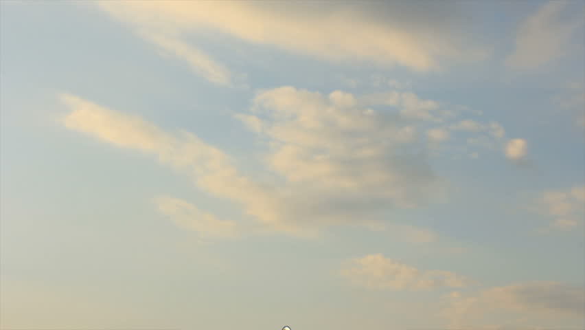 Airplane flying through the sky from below
