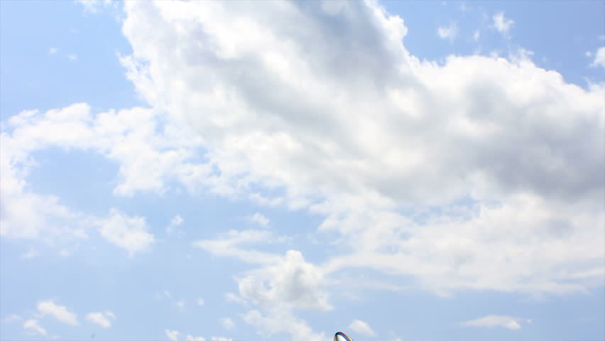 Airplane flying through the sky from below