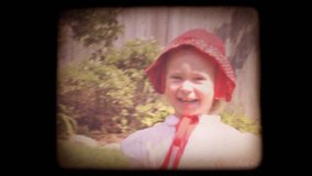Old home movie of a family in their back yard with a vintage 8mm film look. Shot with my family recently, but very authentic looking. Includes projector audio.