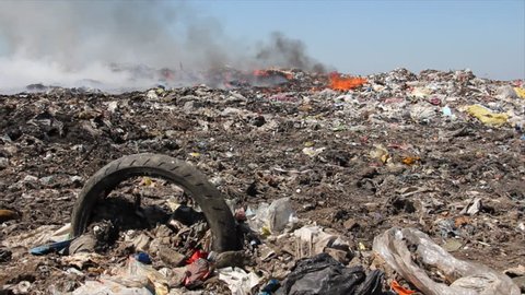 Burning garbage dump, pollution