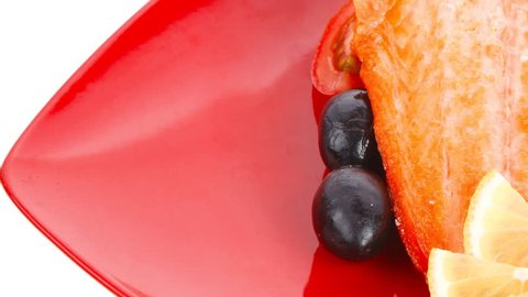 roast salmon fish meat fillet with lemon black greek olives white goat cheese on red plate 1920x1080 intro motion slow hidef hd