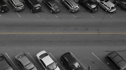 Car finds parking spot. Aerial view of downtown street. Car finds parking spot. Black and white with yellow line. Saint John, New Brunswick, Canada. 