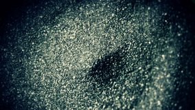 Whirlpool with sand in funnel. ?lose-up 4K UHD 2160p footage. - Powered by Shutterstock - Get 15% off with code: PIKWIZARD15