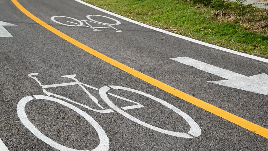 Cycling on bicycle lane outdoors, Cyclists using the designated bicycle lane 
 | Shutterstock HD Video #13312427