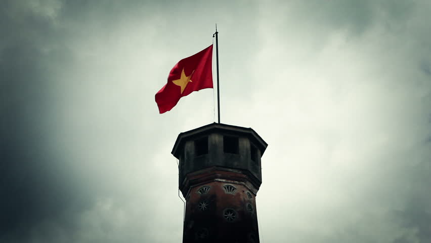 Waving vietnamese flag on top of high tower