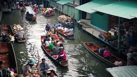 Floating Market With Tourists Passing On River Boats. Thailand