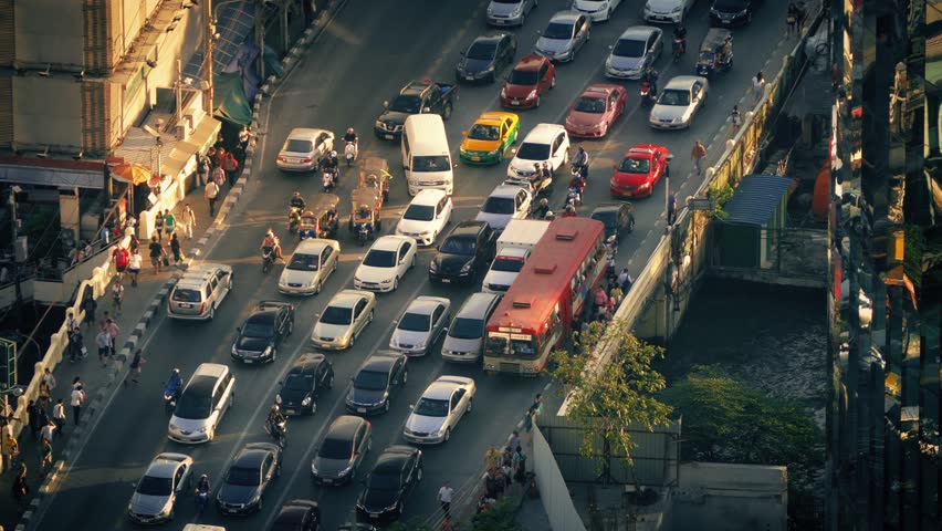 Countless Cars And People Crossing City Bridge In Evening