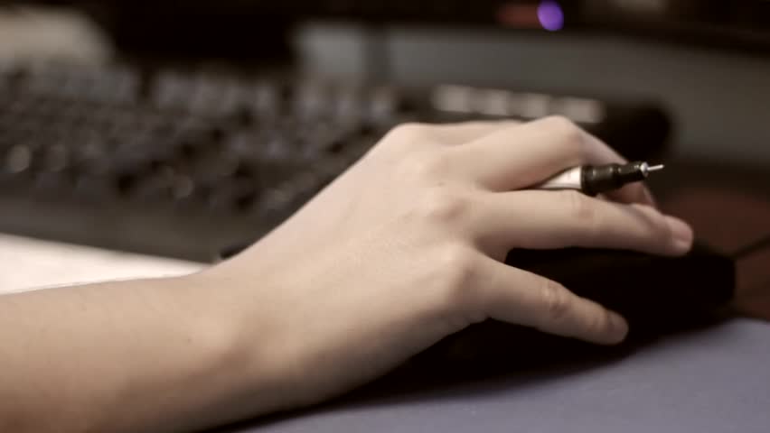 A hand using a computer mouse