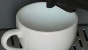 Coffee machine making black hot coffee. closeup 