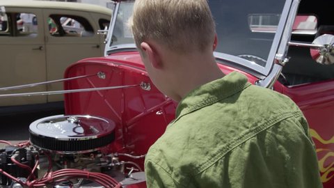 Young Teen Boy Admires Exposed Luxury Hot Rod Engine