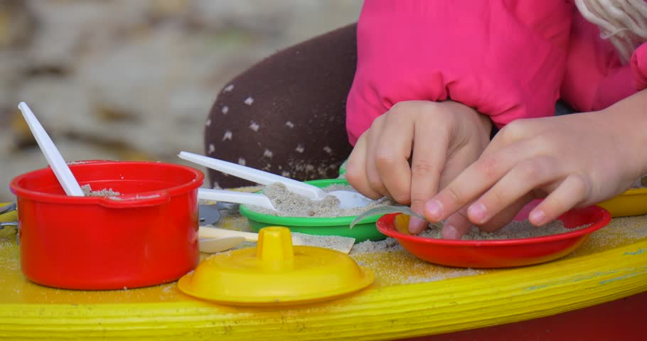 little girl play dishes