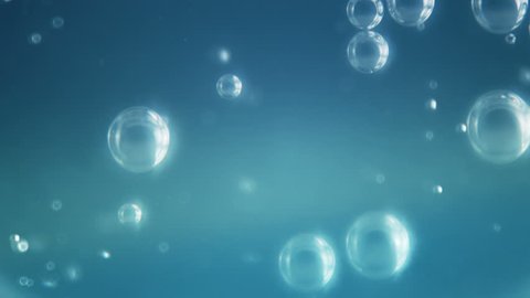 Slow motion bubbles rising in soda / carbonated drink on blue background