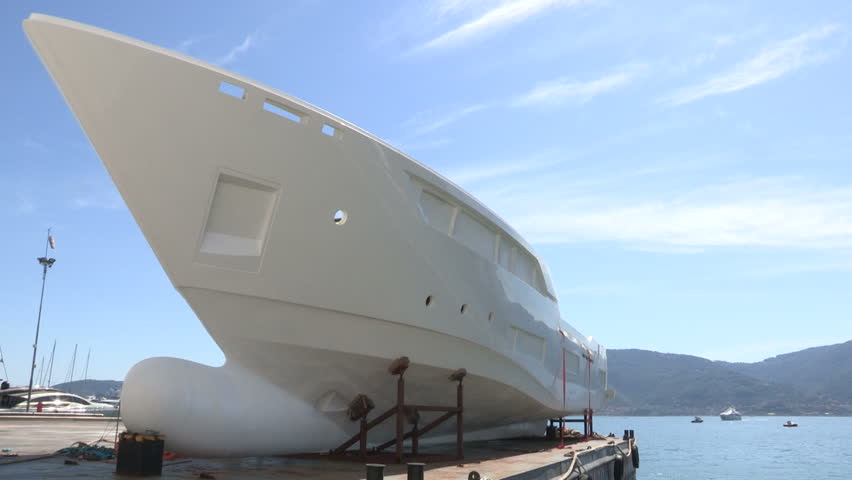 a wide shot of the hull at the shipyard