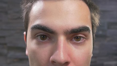 Portrait of a young man. eyes and nose closeup.