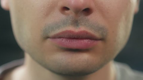 Closeup on the lips of an attractive men