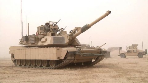 CIRCA 2010s - Abrams tanks sit in the Iraq desert during the war.