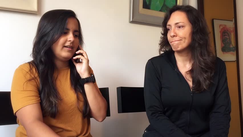 Brazilian Mother Listening Her Daughters Phone Stock Footage Video