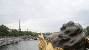 Eiffel tower from Alexander III bridge golden statues Paris France 4K 2160p UltraHD tilt footage - Paris and French sight by the day slow tilting  4K 3840X2160 30fps UHD video