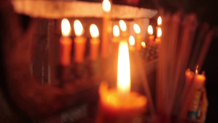 Incense and candles light in church