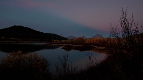 Oxbow Bend with the clouds lighting up at sunrise on a slider.