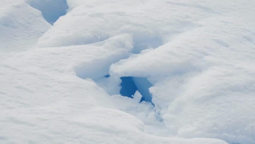 Arctic, Nunavut, Hole in snow revealing Water