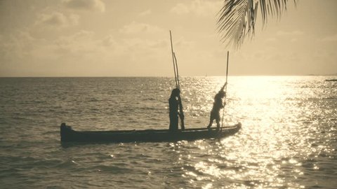 SAN BLAS, PANAMA - CIRCA NOVEMBER 2015: Native fisherman sailing on typic canoe of the San Blas Islands. Slow Motion