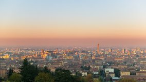 bologna skyline cityscape timelapse from day to night pan as seen from high point of view panning