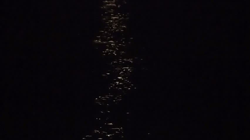 Reflection of moon light on dark sea