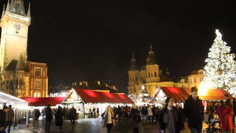 PRAGUE, CZ - DECEMBER 17, 2015: Traditional Christmas markets and astronomical clock at Old towns square in Prague, Czech republic. They open in December and sell typical Christmas gifts