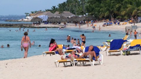 LA ROMANA, DOMINICAN REPUBLIC – NOVEMBER 11, 2012: Unidentified people relax at the beach in La Romana, Dominican Republic.